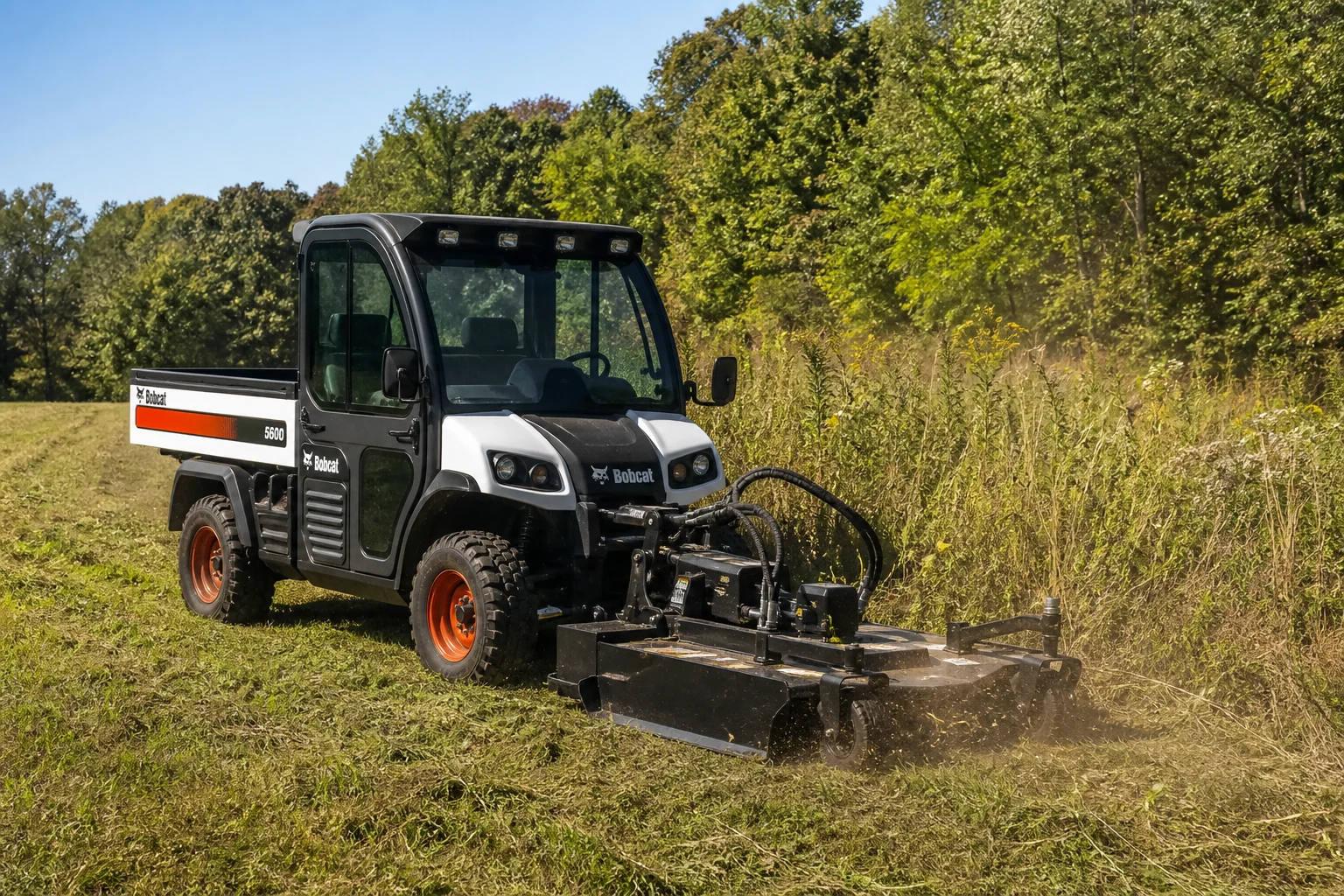 Bobcat Toolcat 5600 using a front-mounted brush cutter on rural acreage